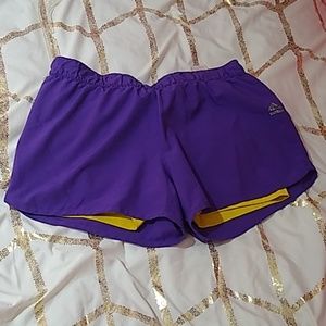 Purple adidas athletic shorts.